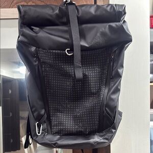 The North Face Black Roll-Top Backpack with Grid Design